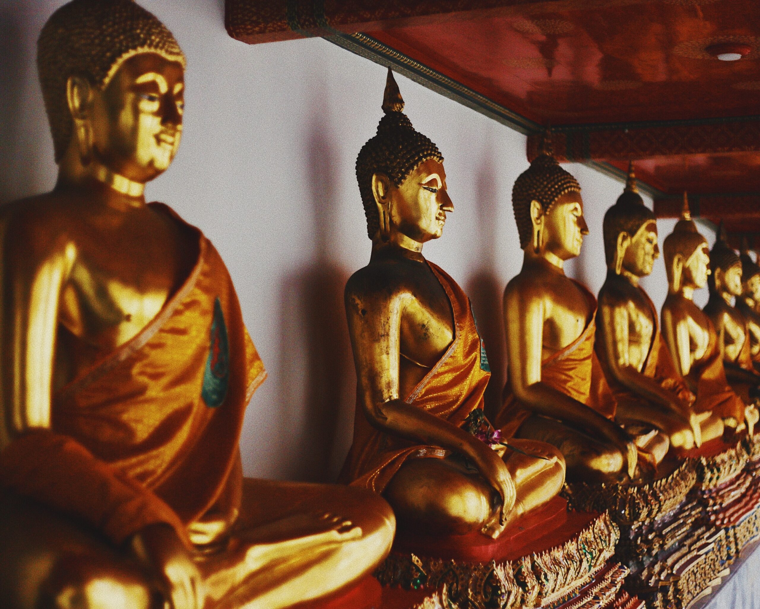 A majestic Buddha statue is shown in the picture