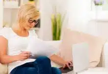 Woman working at home with a laptop