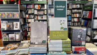 Piles of books about Iceland in an Icelandic bookstore.