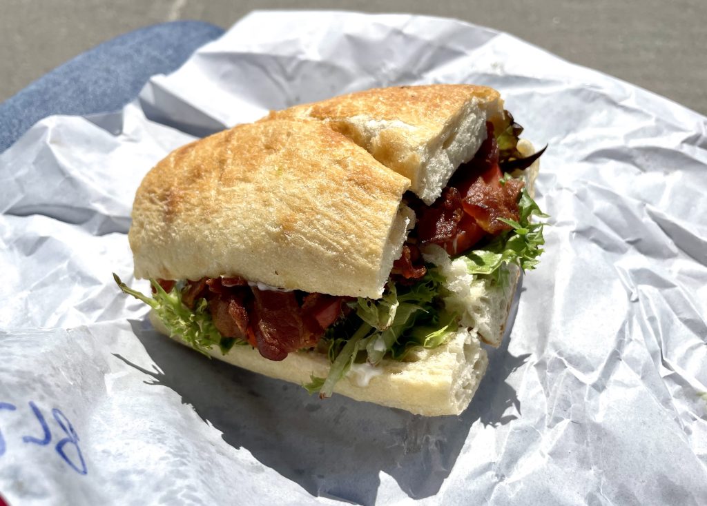 A BLT with layers and layers of crispy bacon in a thick roll.